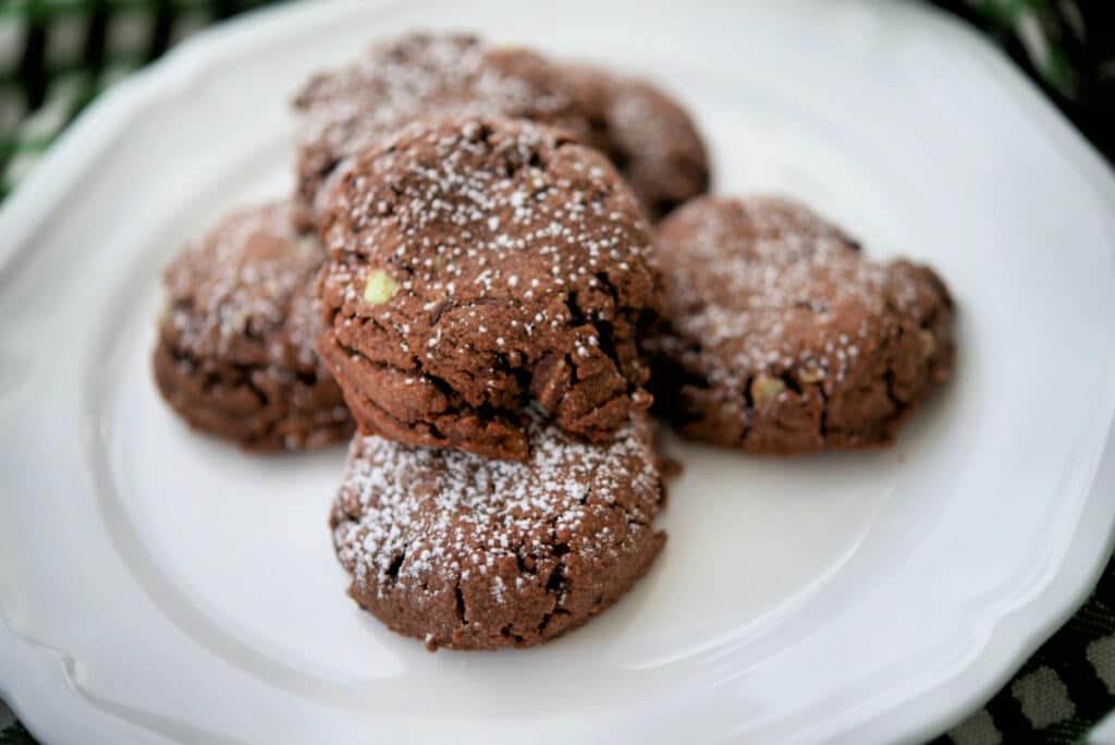 five chocolate cookies on a plate