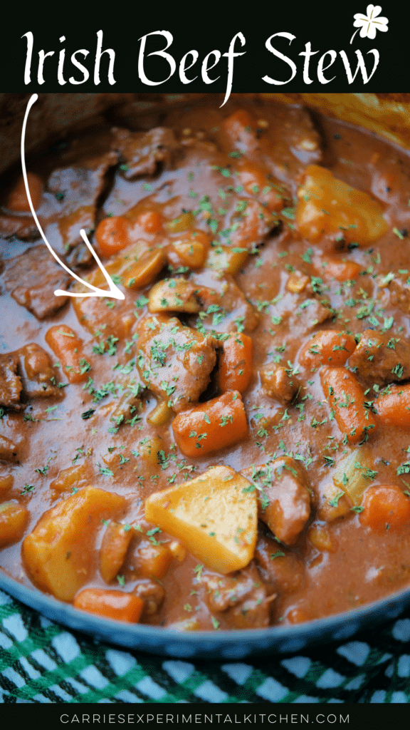 hearty irish beef stew in a blue dutch oven