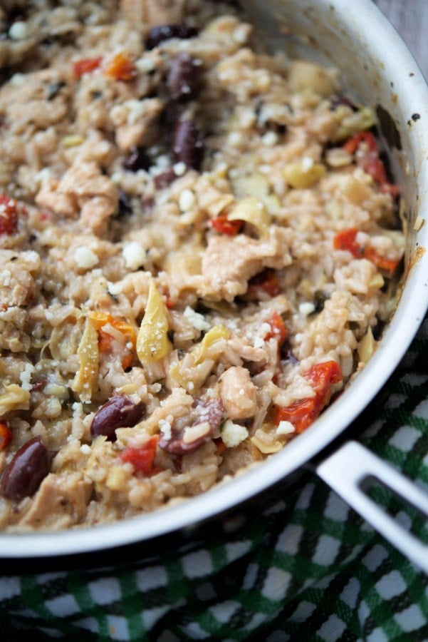 risotto with chicken olives and artichokes in a skillet