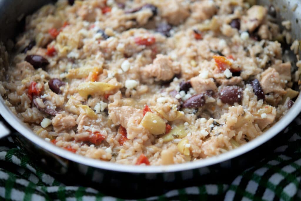 a close up of chicken risotto mediterranean style