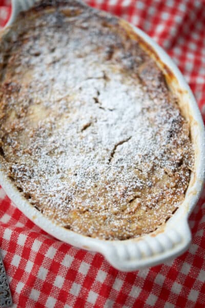 a white dish with banana walnut baked oatmeal