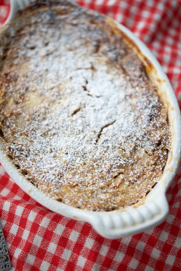 a white dish with banana walnut baked oatmeal