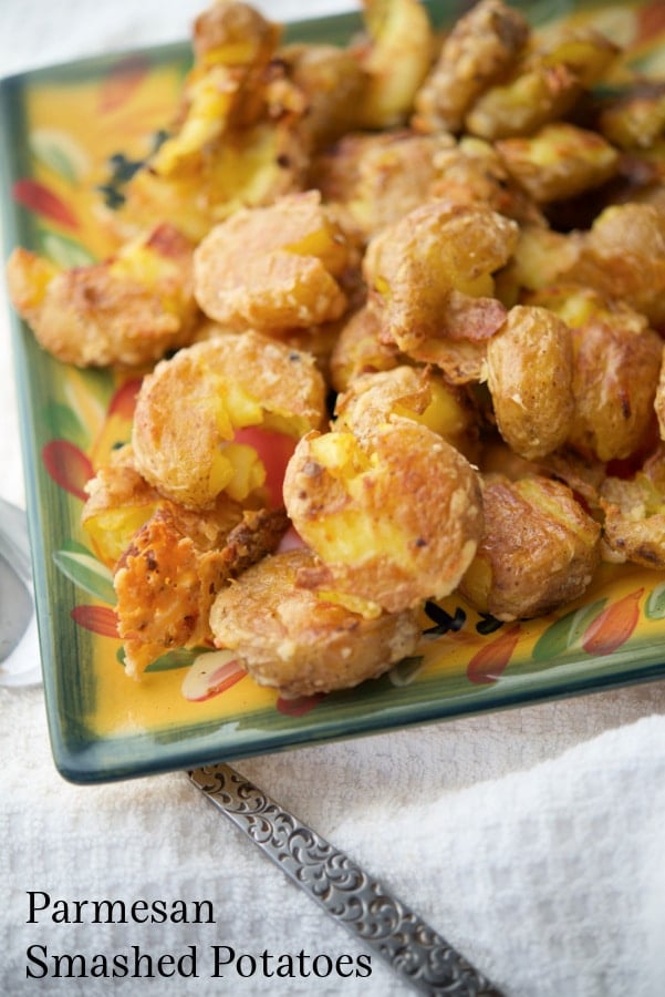 a plate of parmesan smashed potatoes