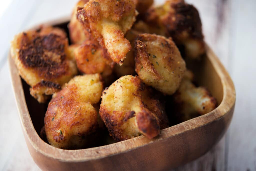 fried cauliflower in a wooden bowl