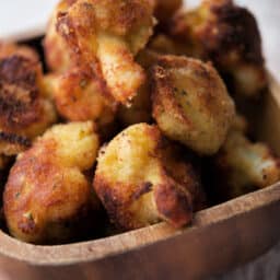 fried cauliflower in a wooden bowl