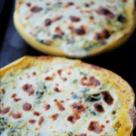 spinach alfredo spaghetti squash on a sheet pan