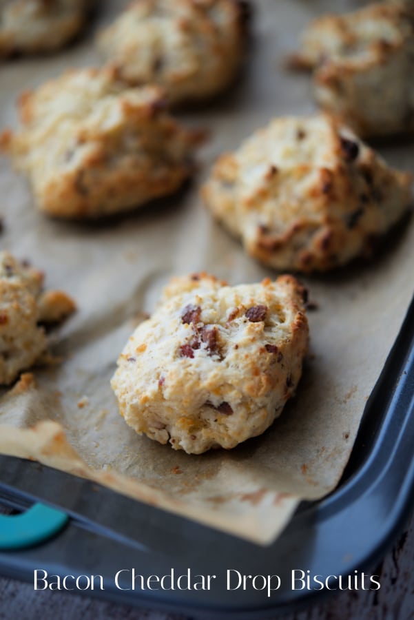 bacon cheddar drop biscuits on a sheet pan