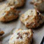 several bacon cheddar drop biscuits on a sheet pan