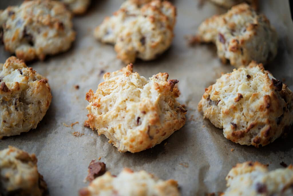 drop biscuits with bacon and cheddar cheese on a sheet pan