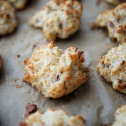 drop biscuits with bacon and cheddar cheese on a sheet pan