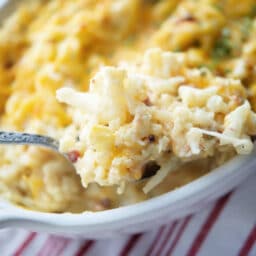 a close up of mashed cauliflower casserole on a spoon