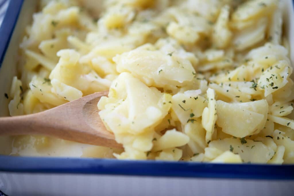 a close up of german potato salad in a dish
