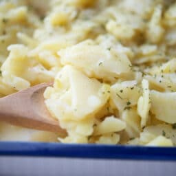 a close up of german potato salad in a dish