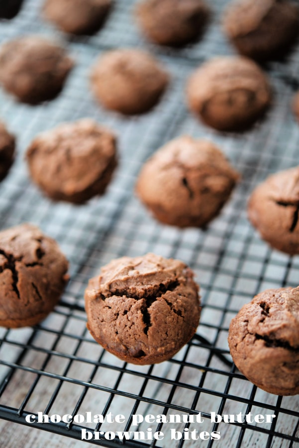 a close up of chocolate peanut butter brownie bites on a cooling rack