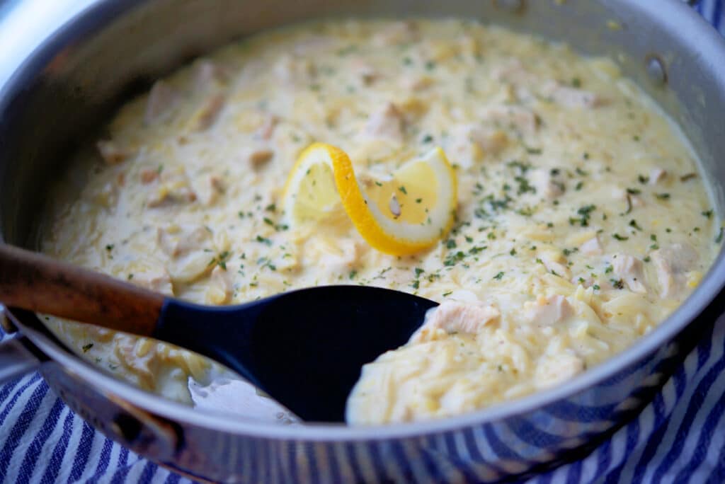 a close up of lemon garlic chicken orzo