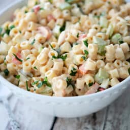 a white bowl filled with amish macaroni salad
