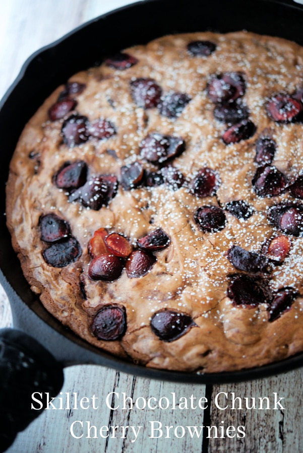 chocolate brownies with cherries in a skillet