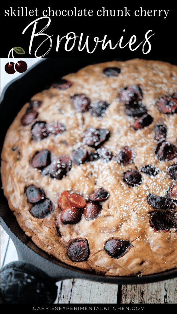 chocolate chunk cherry brownies in a cast iron skillet