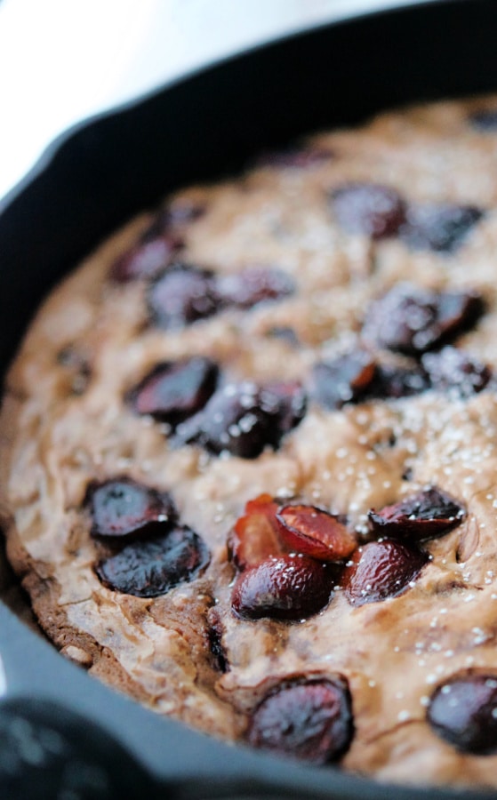 a skillet with chocolate cherry brownies