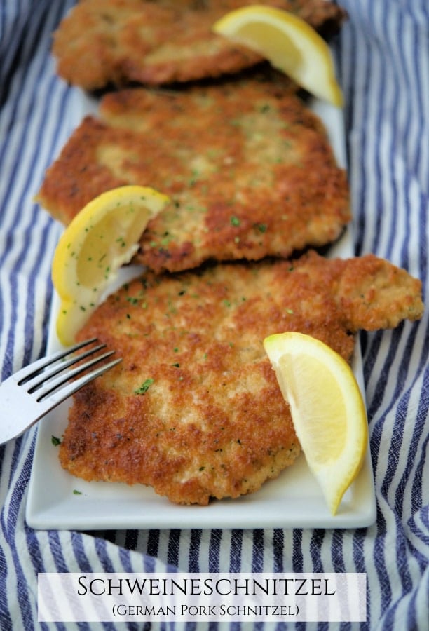 a plate of pork schnitzel