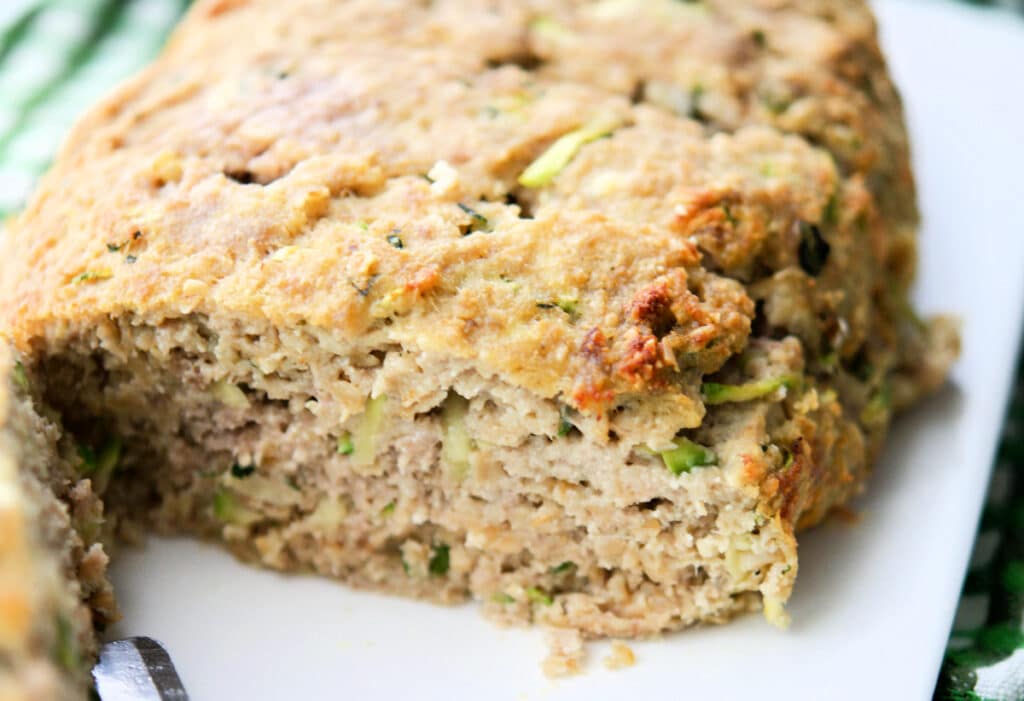 a close up of zucchini ricotta turkey meatloaf
