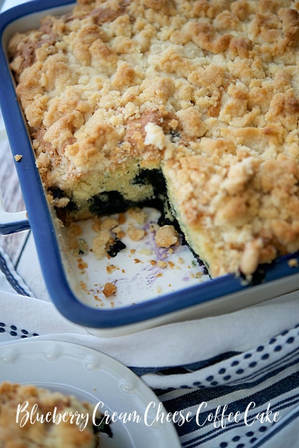 blueberry coffee cake with a piece cut out