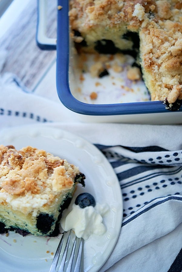 a slice of blueberry coffee cake on a plate