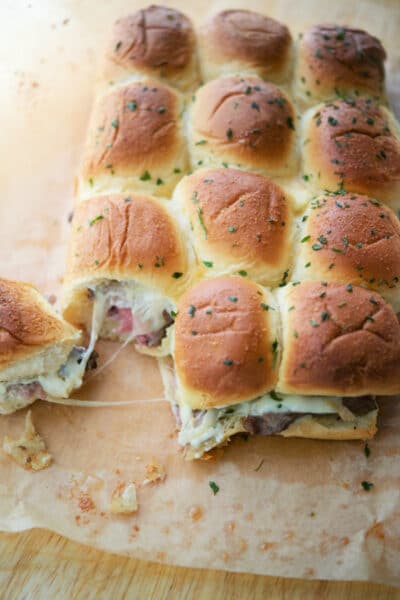 12 rib eye steak sliders on a cutting board