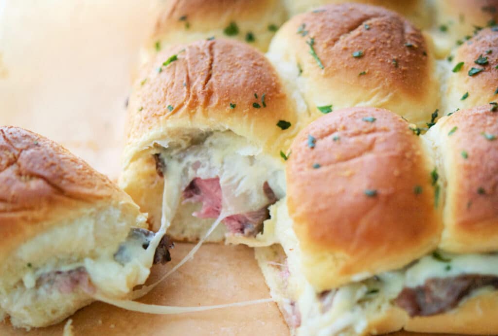 a close up of rib eye sliders