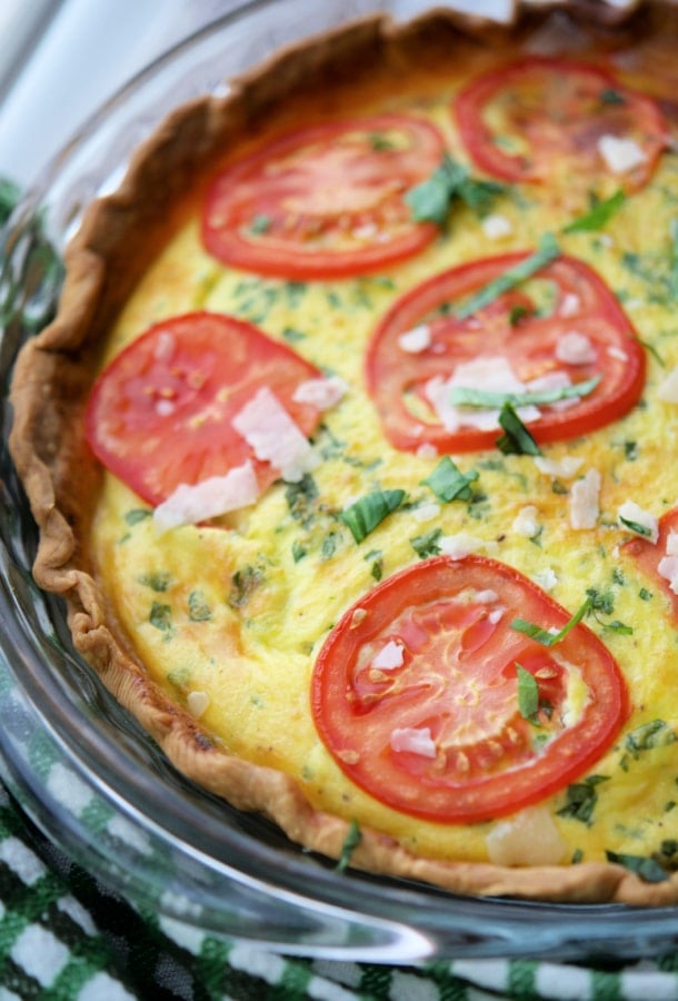 tomato ricotta quiche in a glass pie plate
