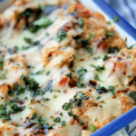 italian chicken quinoa casserole in a white and blue dish