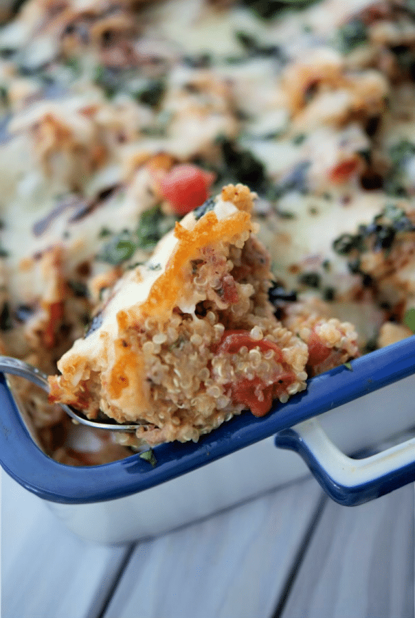 a close up of chicken quinoa casserole on a spoon