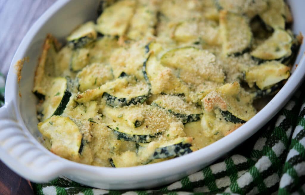 zucchini casserole in a white baking dish