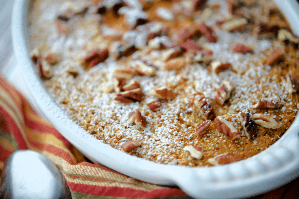 a close up of pumpkin oatmeal in a white baking dish