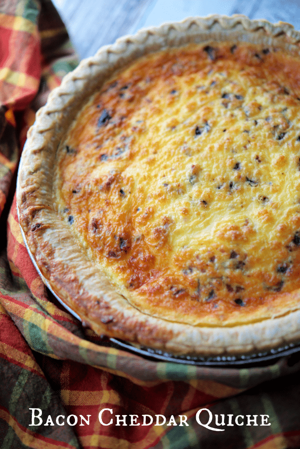 a pie crust with bacon and cheese quiche