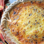 bacon and cheddar quiche in a pie plate