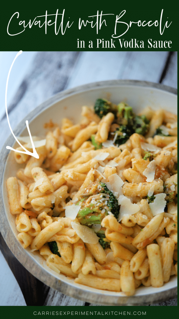 a bowl of cavatelli with broccoli in a vodka sauce