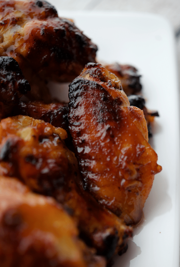 a close up of a hot honey chicken wing