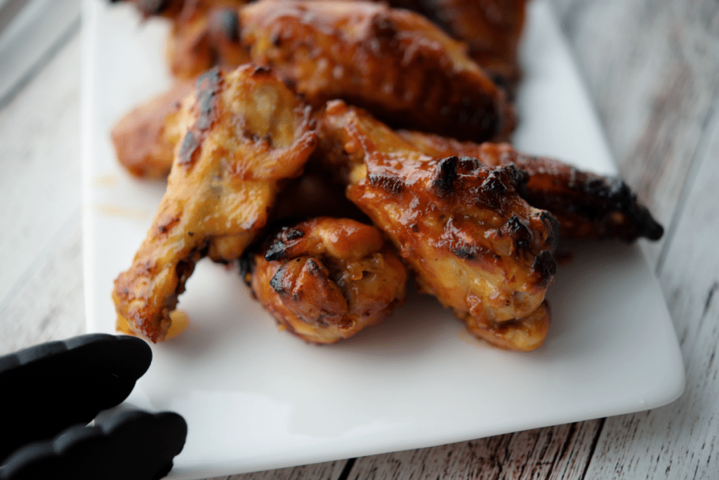 hot honey bbq wings on a plate