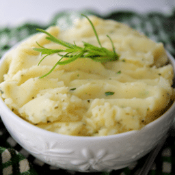 a close up of mashed potatoes in a white bowl