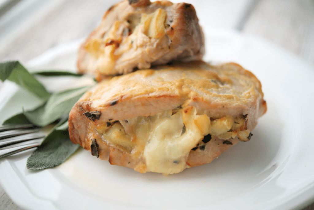 a close up of apple stuffed pork chops
