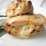 a close up of apple stuffed pork chops