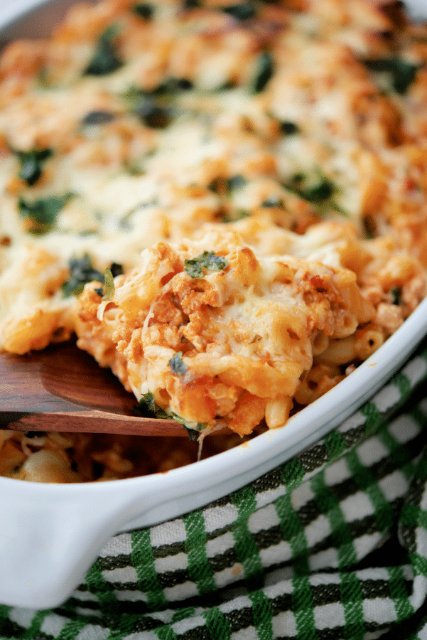 baked macaroni with ground turkey on a wooden spoon