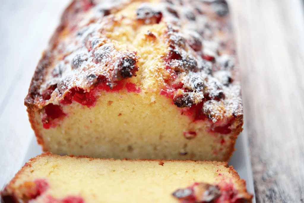 a close up of the top of the sour cream cranberry loaf