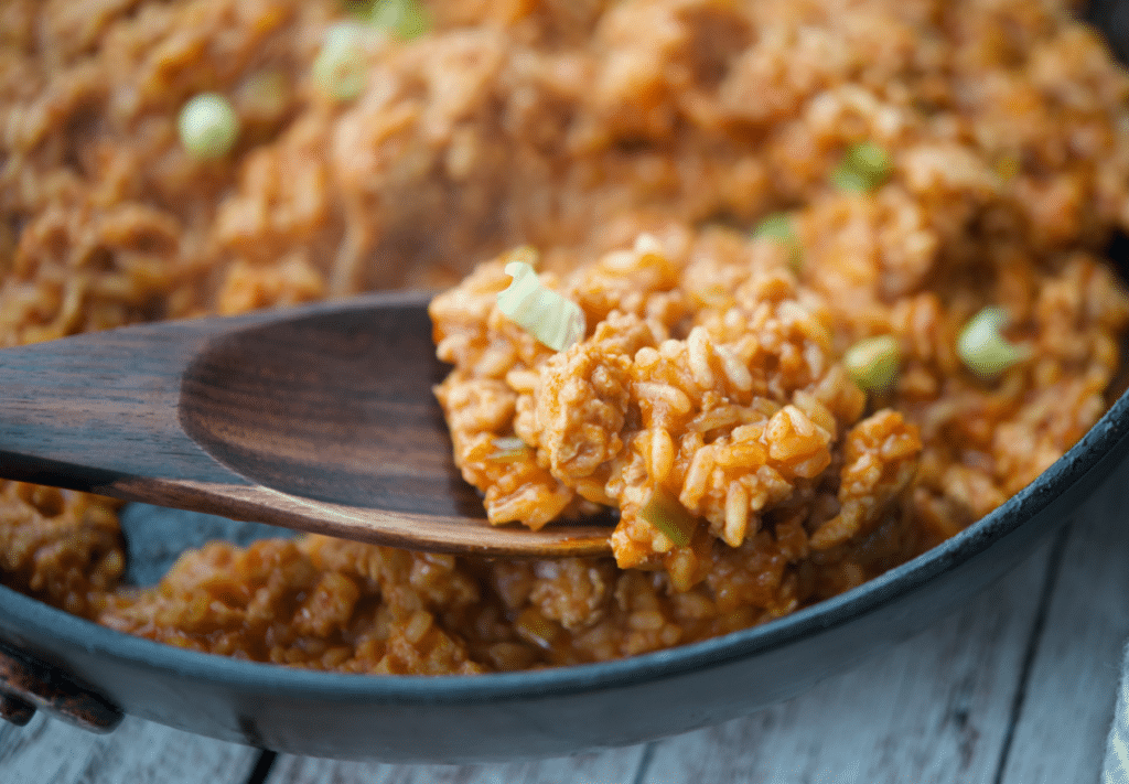 a close up of chicken and rice sloppy joes in a skillet