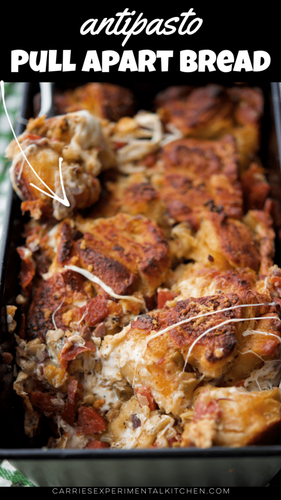 pull part bread in a loaf pan with cured meats and cheese