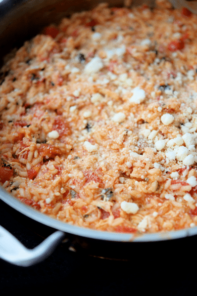 a skillet full of chicken parmesan risotto