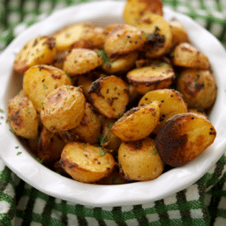 a close up of mustard roasted baby potatoes