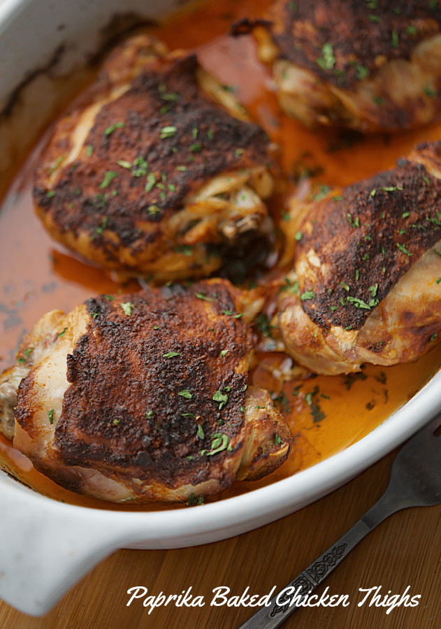 roasted chicken thighs in a white dish