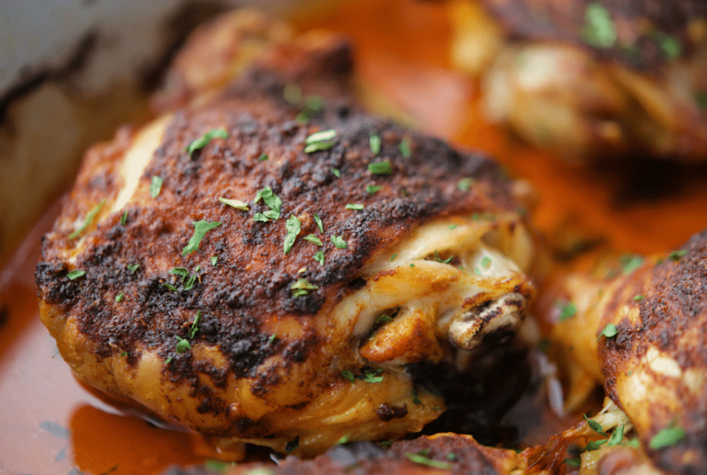a close up of paprika roasted chicken thighs